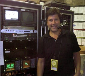 George, the Optimization Guy, in a broadcast control room.